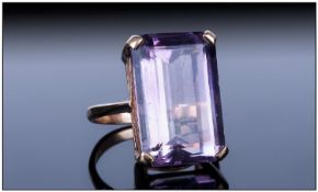 Ladies 9ct Gold Set Large Single Stone Amethyst Ring, The emerald cut Amethyst of about 10cts.