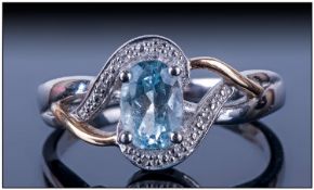 Aquamarine Solitaire Ring, the oval cut stone set in a triple twist 9ct gold and silver design;