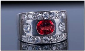 Ladies Sapphire & Diamond Dress Ring, set with an oval cut red Sapphire, (est weight 0.75ct.) Set