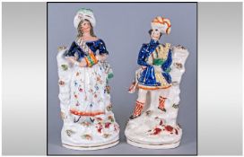A Pair Of Staffordshire Figures. Scottish lady and gentleman. Circa 1860`s. Each stands 11.5 and 12