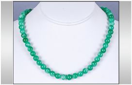 Green Jadeite Stone Bead Necklace, overall uniform colour. 17`` in length white metal clasp.