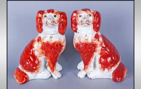 Pair of Red and White Staffordshire Dogs, separate front leg version, well painted; 7 inches high.