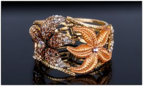 Starfish Crystal and Enamel Bangle, the starfish in either cognac, champagne and white Austrian