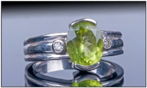 14ct White Gold Set Single Stone Oval Faceted Peridot & Diamond Ring The peridot of good colour &