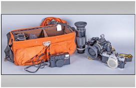 Nikon FM2 Camera With Various Lenses & Accessories. all housed in a canvas carrying case.