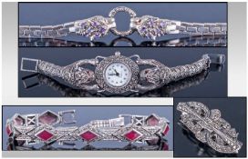 A Silver And Marcasite Articulated Leopards Head Wristwatch. Marked 925. Length 7 inches. Plus a