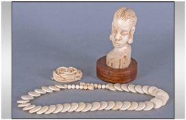 Ivory Coin Shaped Bead Necklace, the beads in an overlapping design, small African female ivory bust