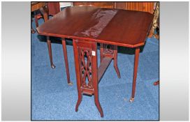 A Mahogany Edwardian Sunderland Small Size Drop Leaf Table, with fretted side supports, supported by