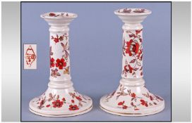 A Pair of 19th Porcelain Candlesticks having original decoration C1870.