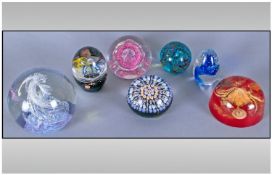 A Good Collection Of Glass Paperweights. 7 in total. Various shapes and sizes. All pieces are in