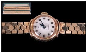 Ladies 9ct Gold Rolex Precision Wristwatch, white enamel dial with Arabic numerals, fitted on a
