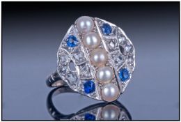 Art Deco Diamond and Sapphire Ring. The Ring Consists of a Centre Line of 5 Cultured Pearls, Set
