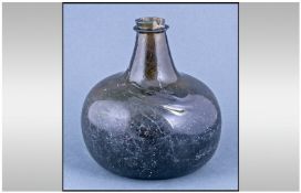 Eighteenth Century Green Glass Wine Bottle, onion shaped, with a short neck and flange, and a deep