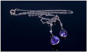Ladies White Gold Pendant Drop, circa 1900s. Set with two pear shaped amethysts and diamond set