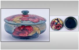 Moorcroft Fine Lidded & Footed Powder Bowl, 'Hibiscus' design On blue/green ground. Circa 1960's.
