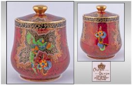 Crown Devon Fieldings Lustre Lidded Tobacco Jar 'Bird Of Paradise' Design. on red lustre ground.