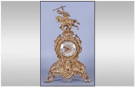20th Century Bras Mantle Clock In The French Rococo Style, with a quartz movement. Height 16 inches.