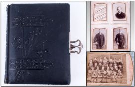 Victorian Photo Album containing assorted black and white family portraits.