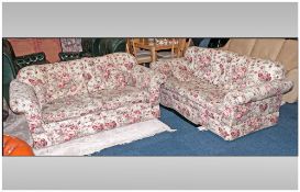 Pair Of Laura Ashley Two Seater Sofas. Classic pink floral design on cream ground. Removable seat