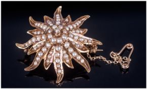 Antique 14ct Gold And Seed Pearl Set Starburst Brooch, with safety chain. Marked 14K. Height 1.25