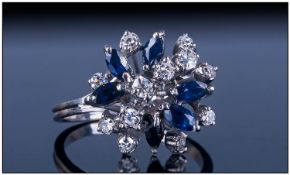 18ct White Gold Diamond And Sapphire Cluster Ring, Set with a row of 5 small round cut diamonds