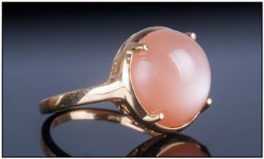 Peach Moonstone Ring, the round cut cabochon stone of 7.75 cts, showing an excellent display of