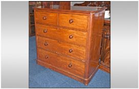 Victorian Mahogany chest of drawers with rolled corners and 3 long drawers below, 2 short drawers.