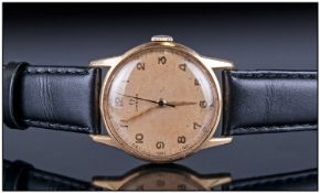 Gents 18ct Gold Omega Wristwatch, circa 1944. champagne dial with Arabic numerals and centre