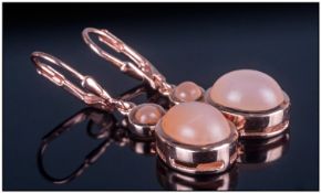 Peach Moonstone Lever Back Earrings, oval cabochon stones, with excellent shiller, totalling 8cts,