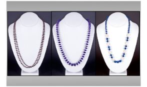 Three Necklaces, Comprising Graduating Amethyst And Seed Pearl The Clasp Stamped 18K. Lapis Lazuli