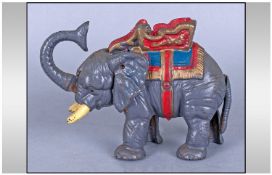 Cast Iron Elephant Money Bank, the coin being placed in the trunk and thrown into a slot at the