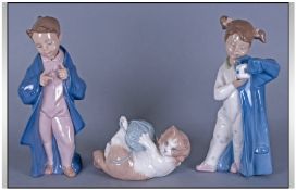 Three Nao Figures By Lladro Comprising girl & boy with jackets & kitten playing with yarn. tallest