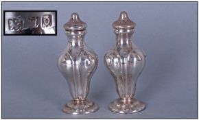 Art Nouveau Pair Of Silver Pepperettes. Hallmark London 1909. Each 3.5" in height.