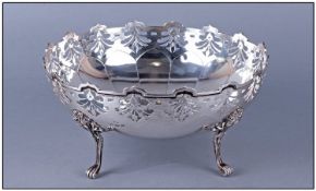 An Elegant And Well Made Silver Footed Fruit Bowl, of the 1920's, with open work and shaped turret