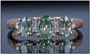Ladies 9ct Gold Set 3 Stone Green Sapphire And Diamond Dress Ring. Fully hallmarked.