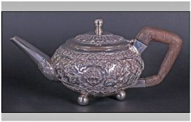 Indian Mid Twentieth Century Fine Silver Teapot with embossed and chased decoration to body, 900