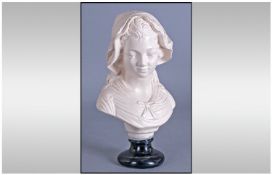 A Plaster Bust of A French Girl in a Bonnet, on black pedestal base. 12 inches in height.