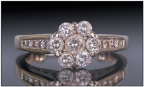 14ct White Gold Set Diamond Cluster Ring. A flower head setting with diamond shoulders. The