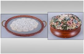 Small Round Foot Stool, with an embroidered top. Together with a small oval glass tray with a lace