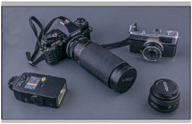 Centon DF-300 Camera together with a Tamron SP Long Range Lens. Plus Olympus Trip 35 plus Centon