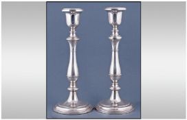 An Elegant And Quality Pair Of 20th Century Silver Candlesticks, in the style of George III.