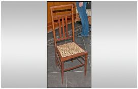 Edwardian Mahogany Inlaid Single Chair with a Bergere seat and slatted back, In the Arts and