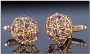 Gents 18ct Gold Cufflinks, of open work design, set with various sized rubies, with swivel fittings,