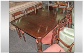 A Dining Room Set Consisting of a Set of Eight Regency Style Chairs with unusual cross stretcher