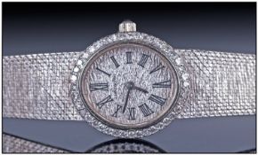 Ladies 18ct White Gold Longines Wristwatch, silvered round textured dial with Roman numerals