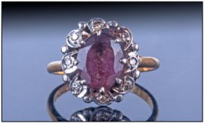 18ct Gold Set Ladies Amethyst and Diamond Cluster Ring. The Central Amethyst, Surrounded by 8
