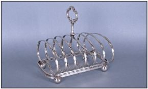 Edwardian Good Silver Plated Six Tier Toast rack. Raised on Four Ball Feet. 5.75" High. 6" Wide.