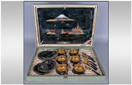 Japanese Black and Gold Lacquer Coffee Set in original box, comprising 6 cups, each with a different