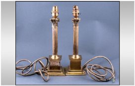 Pair of Brass Corinthian Column Candlesticks, 13 inches in height.
