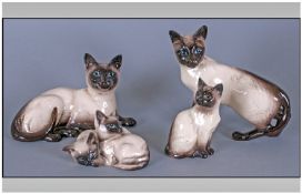 Beswick Siamese Cat Figures, 4 In Total. 1, Siamese Cat, model number 1897, height 6.5 inches. 2,